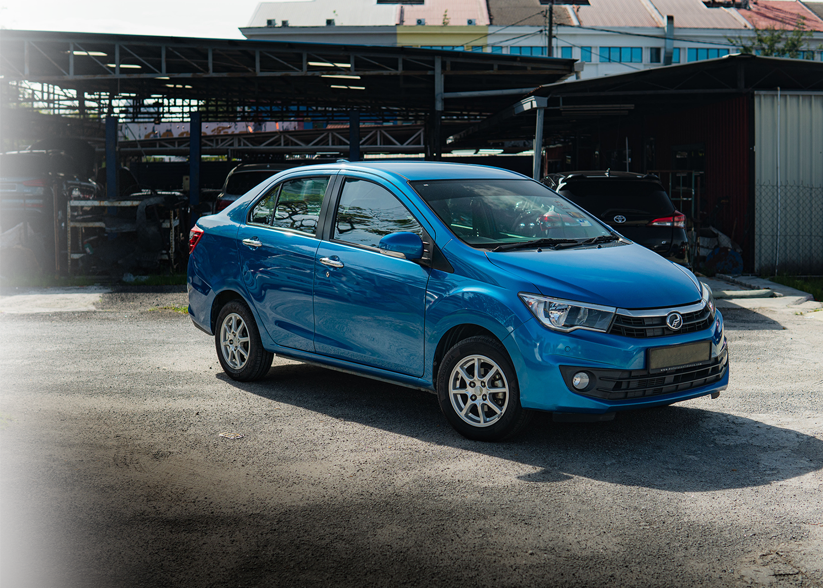 Perodua Bezza compact sedan in vibrant color, ideal for city driving